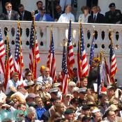 United States veterans hold up our nations flag during the Memorial Day ceremony in Arlington cemetary.