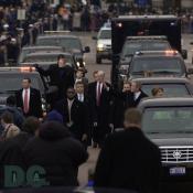 Emerging from their armored limousine, President George W. Bush and first lady Laura Bush wave to well wishers as they prepare to travel 1.7-miles along the inaugural parade route.