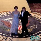 President George Bush and first lady Laura Bush wave to party-goers at the Commander In Chief Presidential Ball in Washington, D.C.