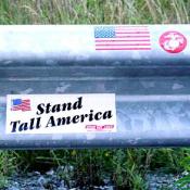 Visitors placed bumper stickers and wrote messages for the victims of Flight 93 on the guardrail of the road next to the crash site.