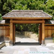 Visitors enter the National Bonsai and Penjing Museum through a Japanese style entrance gate.
