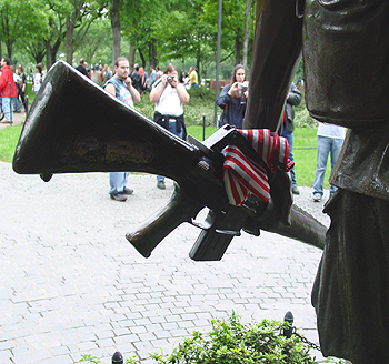 An American flag had been tucked into the hand hold of an M-16.