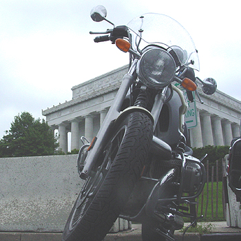 Motorcycle on the side of the Lincoln Memorial.