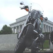 Motorcycle on the side of the Lincoln Memorial.