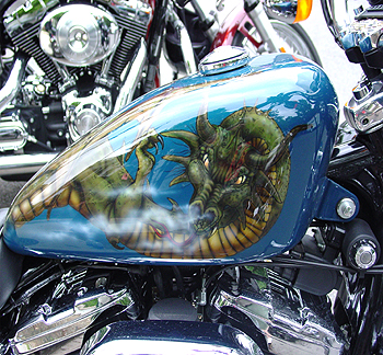 Many of these bikes have incredible airbrush work, such as this dragon on this fuel tank.