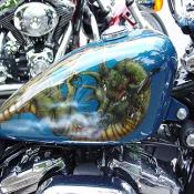 Many of these bikes have incredible airbrush work, such as this dragon on this fuel tank.