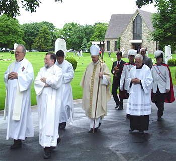 Bishop and deacons exit a Memorial Day dedication ceremony.
