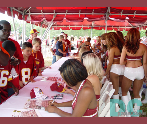 The beautiful and talented Redskin Cheerleaders sign for the fans.