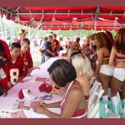 The beautiful and talented Redskin Cheerleaders sign for the fans.