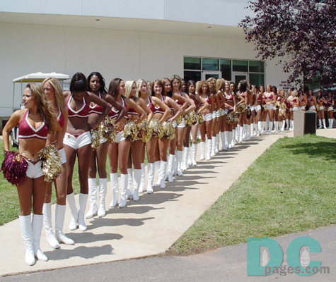 The Redskins Cheerleaders make their way to the practice field to perform.