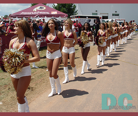 The Redskins Cheerleaders pass by the excited fans eager for entertainment.