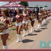 The Redskins Cheerleaders pass by the excited fans eager for entertainment.