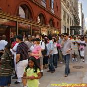 Line forms outside Madame Tussauds along 12th Street, NW.