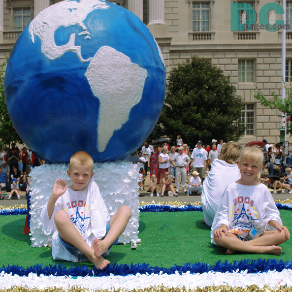 blonde haired kids on the earth float.