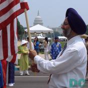 American Sikh proudly displays the American Flag. United States Capitol Building in background.