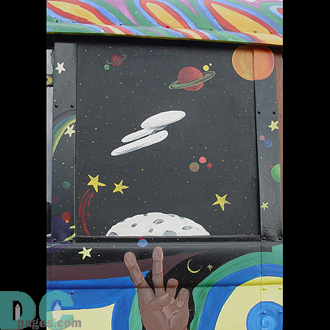 A close up of the window artwork uncovers a spaceship heading towards Saturn.