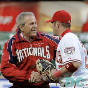 Washington Nationals' Inaugural Home Opener - President George W. Bush and Washington Nationals catcher Brian Schneider shake hands after the President threw the ceremonial first pitch Thursday, April 14, 2005.   White House photo by Paul Morse
