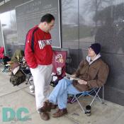 Major League Baseball, Washington Nationals, management talks to the first person in line waiting to purchase tickets at 12:00 pm.