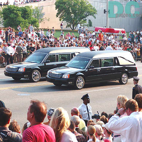 Two hearses lead the President's casket.