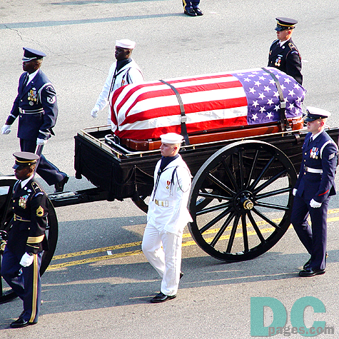 Reagan's casket draped with an American flag proceeds to the U.S. Capitol.