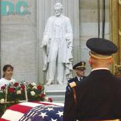 A statue of Lincoln Memorial watches over another deceased President.