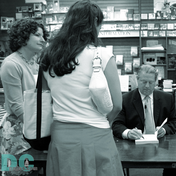 This woman stared dreamily at Mr. Gore signing her book.