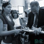 This lady wanted Mr. Nader to sign next to Al Gore's. Mr. Nader thought its was not proper to sign another author's work and wrote his autograph on a piece of paper instead.