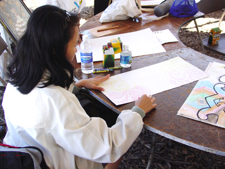 Festival participants draw tribal ancestors in the Maori Art workshop, September 10, 2003
