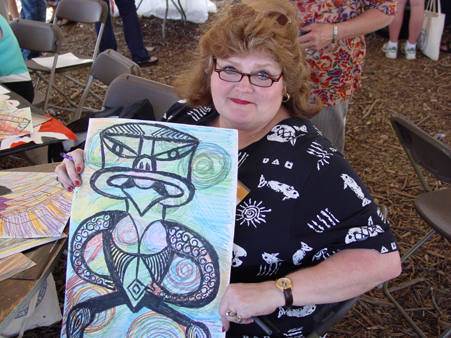 Art teacher (Judy Ball Johnson) proudly displays her Maori Art Ancestor, September 10, 2003