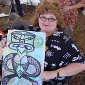 Art teacher (Judy Ball Johnson) proudly displays her Maori Art Ancestor, September 10, 2003