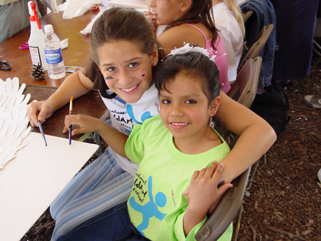 Young Art winners from (Carmen) Georgia and Peru work together on Elaine Thomas  Angel of Nations project, September 9, 2003.