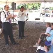 Gary De Carolis, president of the Center for Community Leadership, is assisted by a sign language interpreter as he leads a workshop on creativity and leadership in the Festival School, September 10, 2003