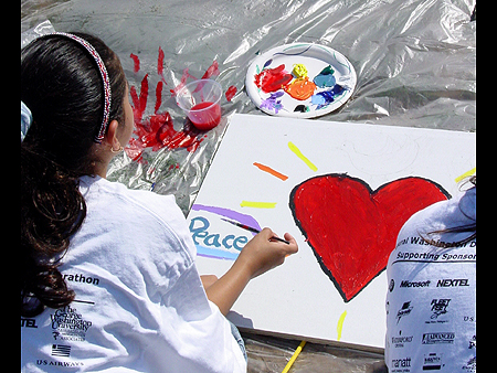 ICAF Young Artist paints her panels for George Rodrigue Art for Peace Pyramid, September 11, 2003