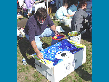 George Rodrigue paints the Blue Dog on a panel for the Art for Peace Pyramid