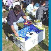 George Rodrigue paints the Blue Dog on a panel for the Art for Peace Pyramid