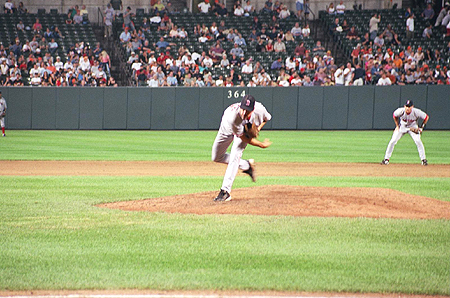 The Boston Red Sox pitcher, John Burkett throws a wide curve ball.
