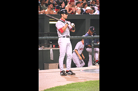 A Boston Red Sox player waits his turn at bat.